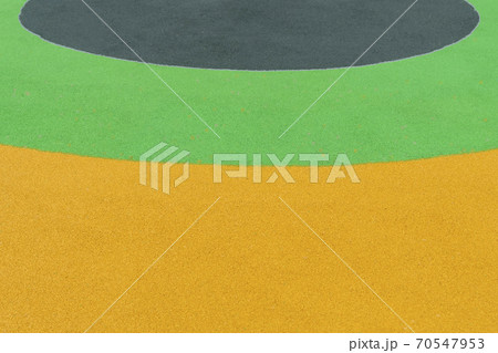 Bright multi-colored background from a coating of rubber crumb. Background from anti-traumatic material Bright multi-colored background from a coating of rubber crumb. Background from anti-traumatic material 70547953