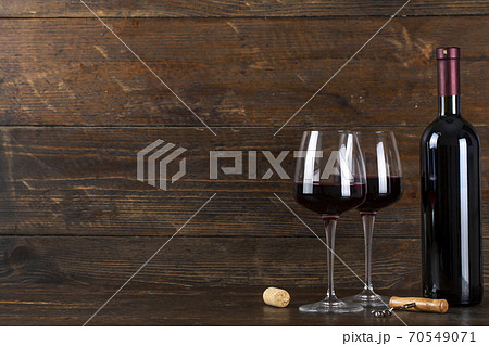 Bottle of wine and two glasses. Bottle of wine and two glasses. 70549071