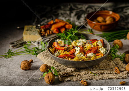 Homemade pasta with roasted pumpkin and blue cheese Homemade pasta with roasted pumpkin and blue cheese 70552993