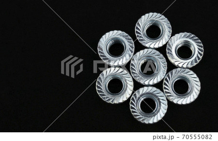 Nuts arranged in star on black background Nuts arranged in star on black background 70555082
