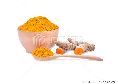 Finely dry Turmeric (Curcuma longa Linn) powder in wooden bowl and spoon with rhizome (root) isolated on white background. 70556509