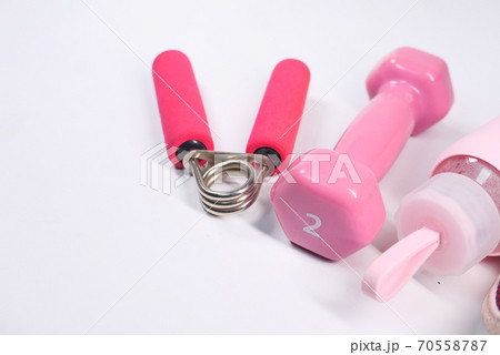 pink color dumbbell and water bottle on white background pink color dumbbell and water bottle on white background 70558787