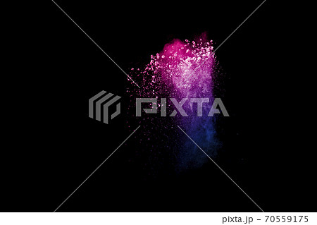 Freeze motion of colorful dust particles splash. Painted Holi powder. Freeze motion of colorful dust particles splash. Painted Holi powder. 70559175