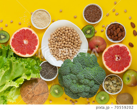 Healthy eating ingredients: vegetables, fruits, seeds. Clean eco food concept Healthy eating ingredients: vegetables, fruits, seeds. Clean eco food concept 70559202