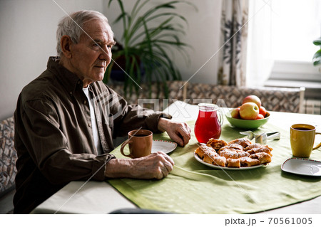 Aged man drinking tasty tea Aged man drinking tasty tea 70561005