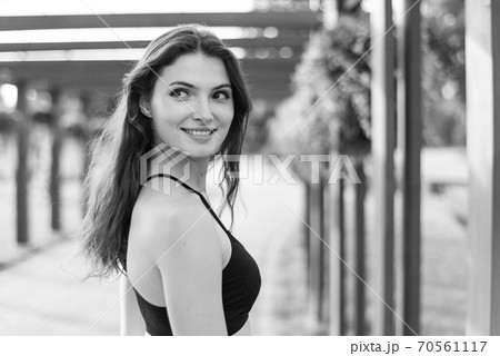 Portrait of a beautiful young sporty brunette girl. Black and white photo. BW Portrait of a beautiful young sporty brunette girl. Black and white photo. BW 70561117
