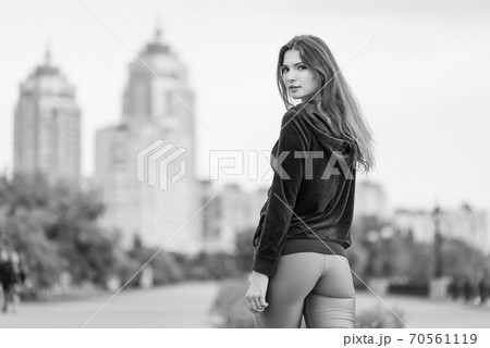 Portrait of a beautiful young sporty brunette girl. Black and white photo. BW 70561119