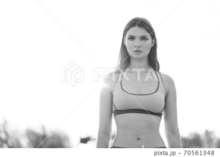 Portrait of a beautiful young sporty brunette girl. Black and white photo. BW Portrait of a beautiful young sporty brunette girl. Black and white photo. BW 70561348