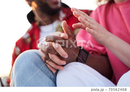 Caring couple connecting hands in open air Caring couple connecting hands in open air 70562408