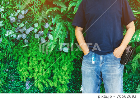 Mini portable alcohol gel bottle to kill Corona Virus(Covid-19) hanging on belt loop of man' s jeans with plants background. New normal lifestyle. Health care concept. Selective focus on alcohol gel Mini portable alcohol gel bottle to kill Corona Virus(Covid-19) hanging on belt loop of man' s jeans with plants background. New normal lifestyle. Health care concept. Selective focus on alcohol gel 70562692