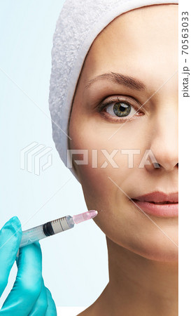 Woman face cosmetology treatment. Biorevitalization skin therapy. Doctor filler Woman face cosmetology treatment. Biorevitalization skin therapy. Doctor filler 70563033