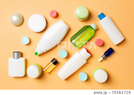 Group of plastic bodycare bottle Flat lay composition with cosmetic products on colored background empty space for you design. Set of White Cosmetic containers, top view with copy space 70563729