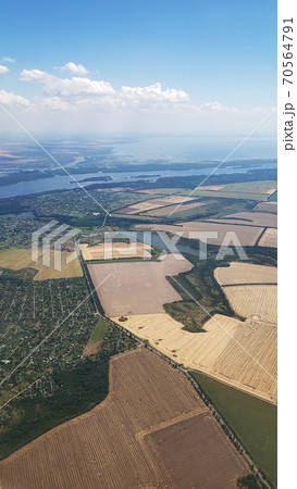 The view from the airplane window to the ground. Landscape view from the sky 70564791