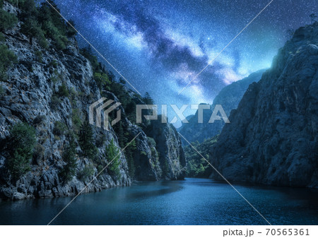Milky Way over the beautiful mountain canyon and sea at night Milky Way over the beautiful mountain canyon and sea at night 70565361