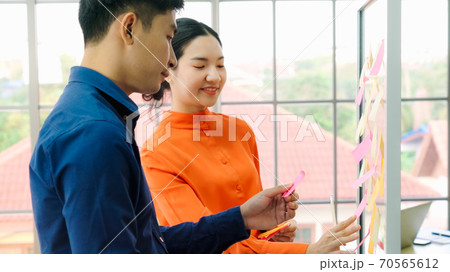 Business people work on project planning board Business people work on project planning board 70565612