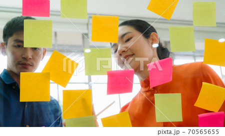 Business people work on project planning board 70565655