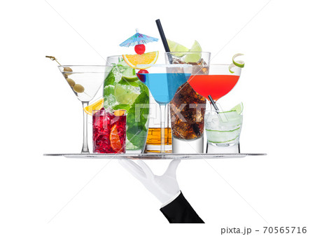 Batler waiter wearing white glove tray with cocktails 70565716