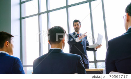 Group of business people meeting in a seminar conference Group of business people meeting in a seminar conference 70565717