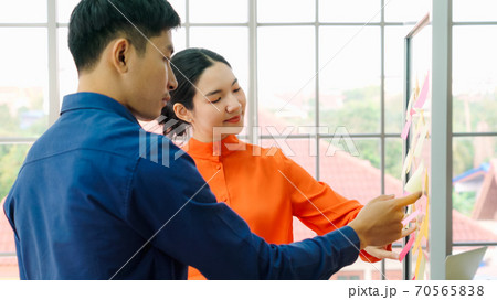 Business people work on project planning board Business people work on project planning board 70565838