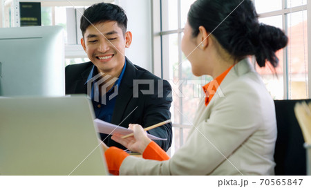 Two business people talk project strategy at office Two business people talk project strategy at office 70565847