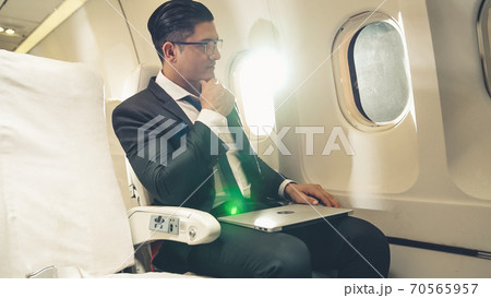 Businessman travel on a business trip by airplane Businessman travel on a business trip by airplane 70565957