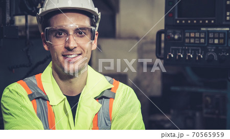 Young factory worker or engineer close up portrait in factory 70565959
