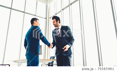 Business people handshake in corporate office Business people handshake in corporate office 70565961