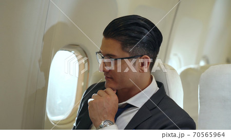 Businessman travel on a business trip by airplane Businessman travel on a business trip by airplane 70565964