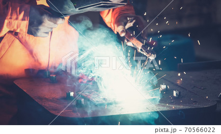 Metal welder working with arc welding machine Metal welder working with arc welding machine 70566022