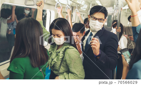 Sick man on train cough and make other people feel worry about virus spreading 70566029