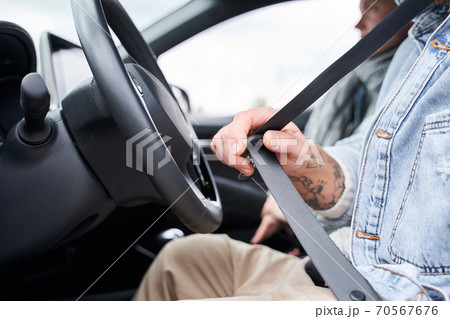 Man sitting in driving seat of car Man sitting in driving seat of car 70567676