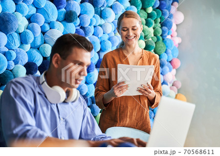 Colleagues are working in office 70568611