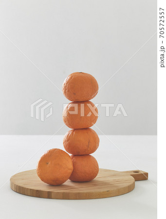 Orange fruits on cutting board Orange fruits on cutting board 70572557