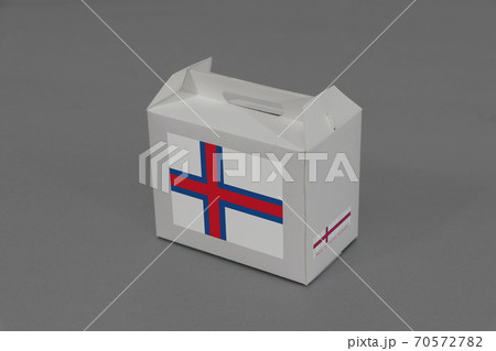 Faroe flag on white box with barcode and the color of nation flag on grey background. Faroe flag on white box with barcode and the color of nation flag on grey background. 70572782
