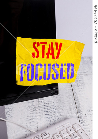 Writing note showing Stay Focused. Business photo 70574496