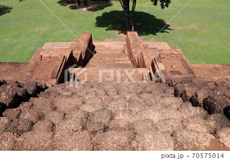 ancient laterite stone stairway down of the base of the main stupa, Khao Klang Nok 70575014