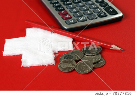 Coins of Switzerland with calculator and pencil on the red PVC leather with white cross fabric Coins of Switzerland with calculator and pencil on the red PVC leather with white cross fabric 70577816