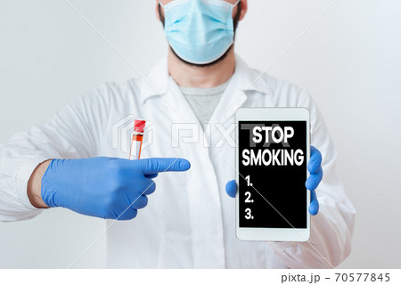 Writing note showing Stop Smoking. Business photo 70577845