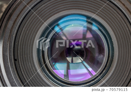 A view to the used lens close up. Lens of camera. A view to the used lens close up. Lens of camera. 70579115