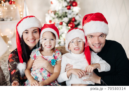 Beautiful happy caucasian family. Portrait of 70580314