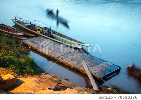 Traditional boats for transport people on the Mekong River at sunset, Luang Prabang, Laos. 70580336
