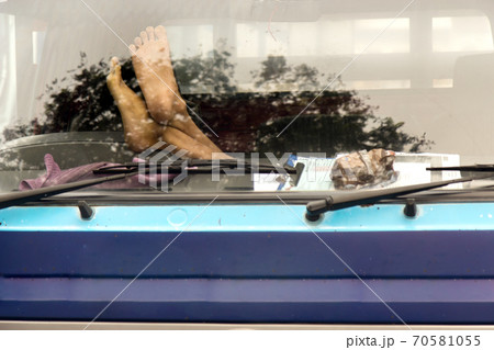 Male feet on the dashboard of the truck Male feet on the dashboard of the truck 70581055