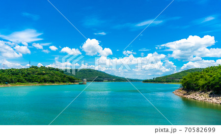Panorama of Numerous wind turbines in the vast forest with mountains and sky as background at Lam Ta Khong Reservoir, Sikhio, Thailand. Panorama of Numerous wind turbines in the vast forest with mountains and sky as background at Lam Ta Khong Reservoir, Sikhio, Thailand. 70582699
