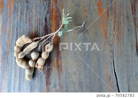 Tamarind on the wooden table background. Tamarind on the wooden table background. 70582783