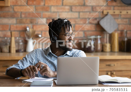 Smiling biracial male student dream at home 70583531