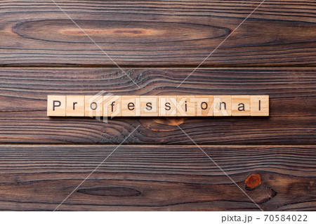 Professional word written on wood block. Professional text on cement table for your desing, concept Professional word written on wood block. Professional text on cement table for your desing, concept 70584022