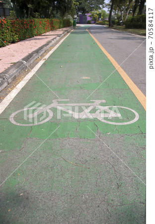 The white bicycle painting on the green bike lane. The white bicycle painting on the green bike lane. 70584117