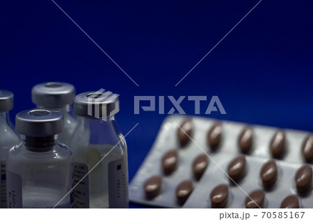Vaccine bottles with many pills close up Vaccine bottles with many pills close up 70585167