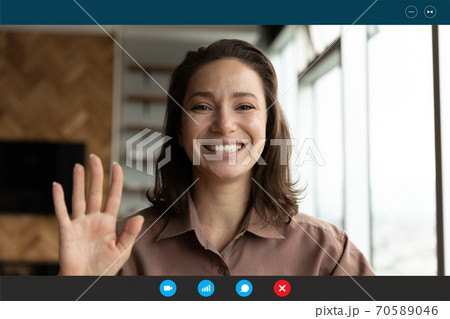 Head shot portrait screen view smiling woman waving hand Head shot portrait screen view smiling woman waving hand 70589046