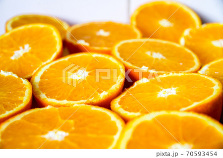 Bunch of fresh sliced oranges on a tray 70593454
